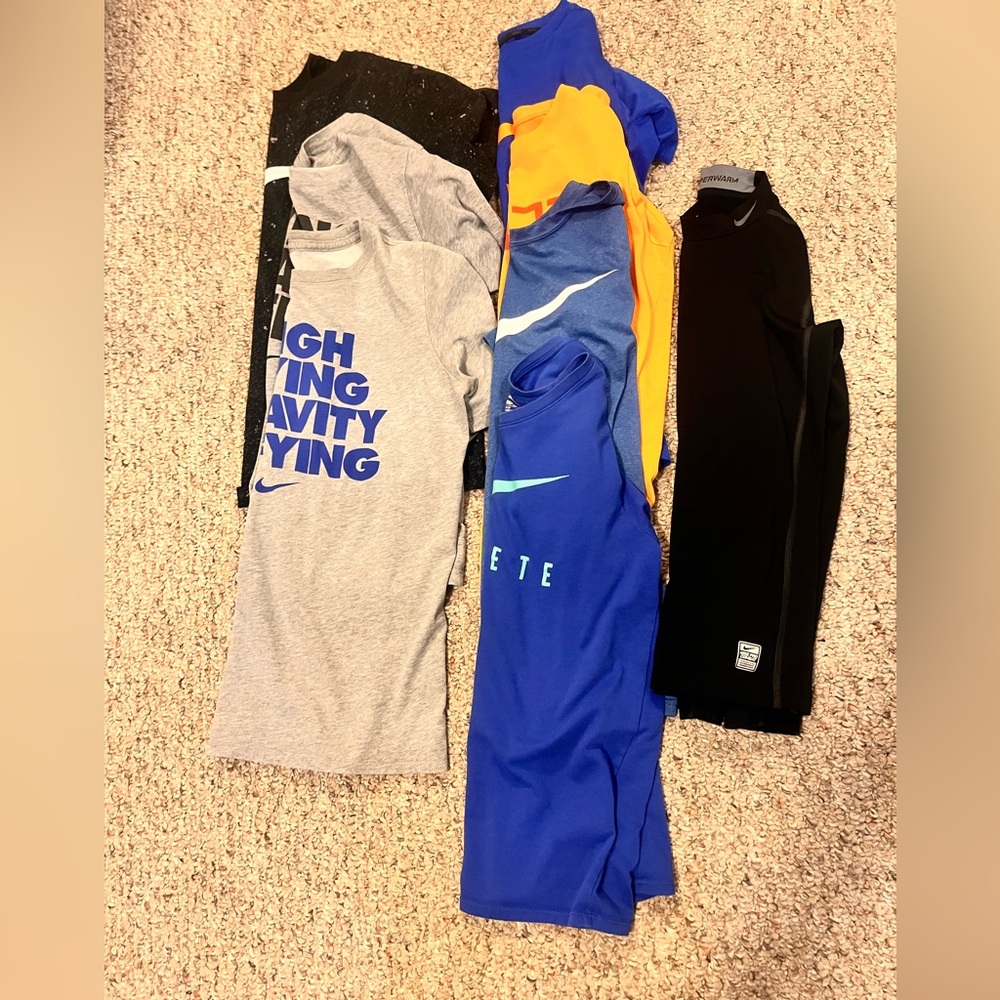Nike Youth large lot. 7 T shirts and 1 long sleeve Nike pro combat shirt